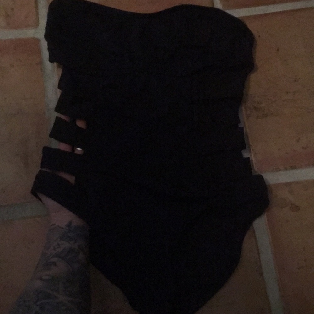 Black one piece sides cut out